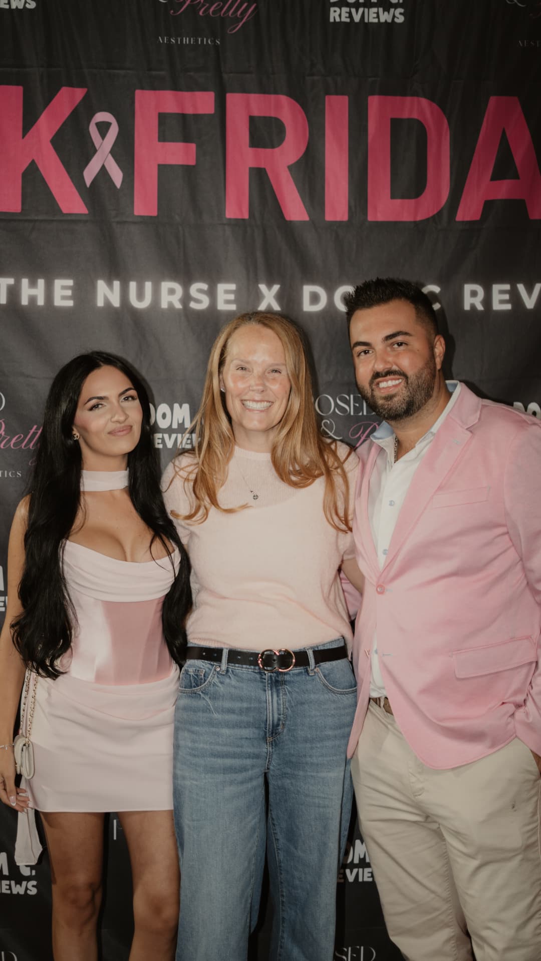 Dom C with his co host Francesca and a guest at the Pink Friday backdrop